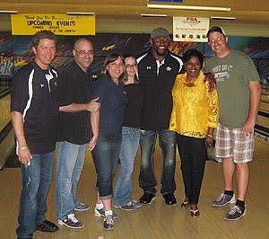 Cruise Web Team Members and Kathy Donnelly of Carnival Cruises pose with Ray Lewis